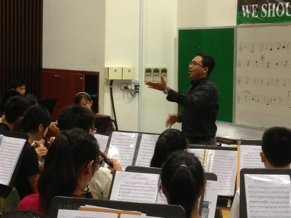 Conducting the Raffles Symphonic Band